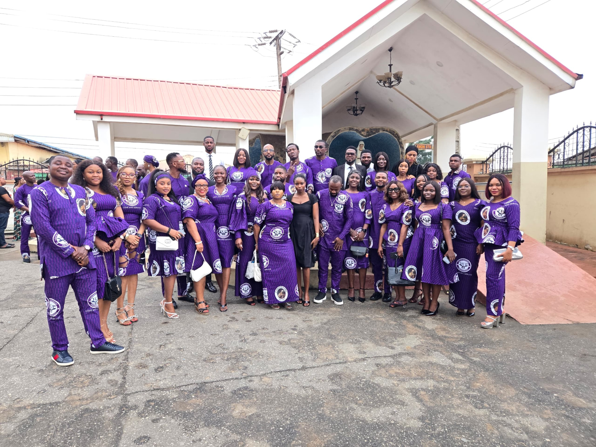 Young Catholic Professionals chapter members in matching attire outside their parish church